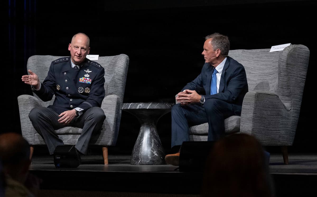 Gen. Mike Guetlein and retired Lt. Gen. Dan Karbler seated during a fireside chat at a defense symposium