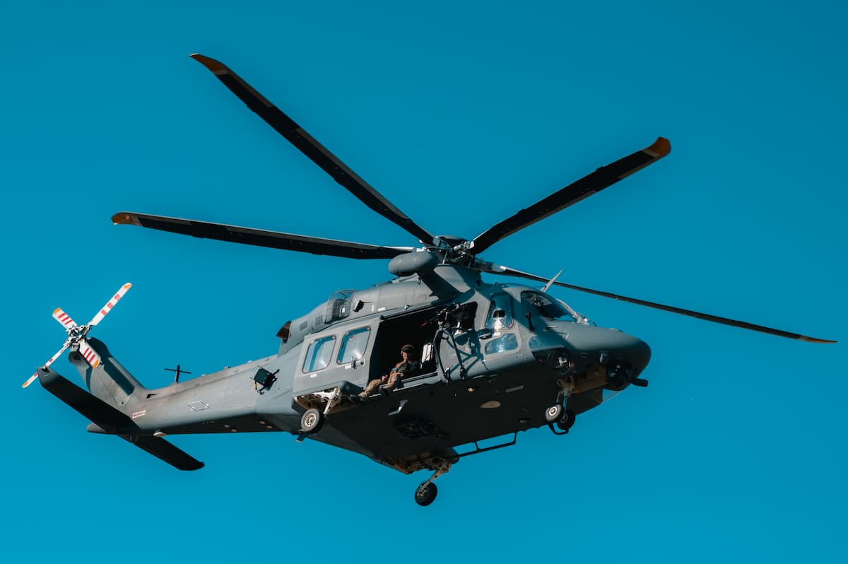An MH-139 Grey Wolf flies overhead during a convoy response exercise at Camp Guernsey