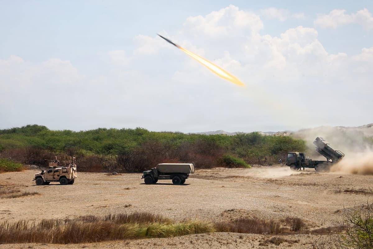A Japan Ground Self-Defense Force Type 88 surface-to-ship missile launcher fires next to U.S. Marine NMESIS and MADIS systems at Paoay Sand Dunes, Philippines, May 6, 2026.