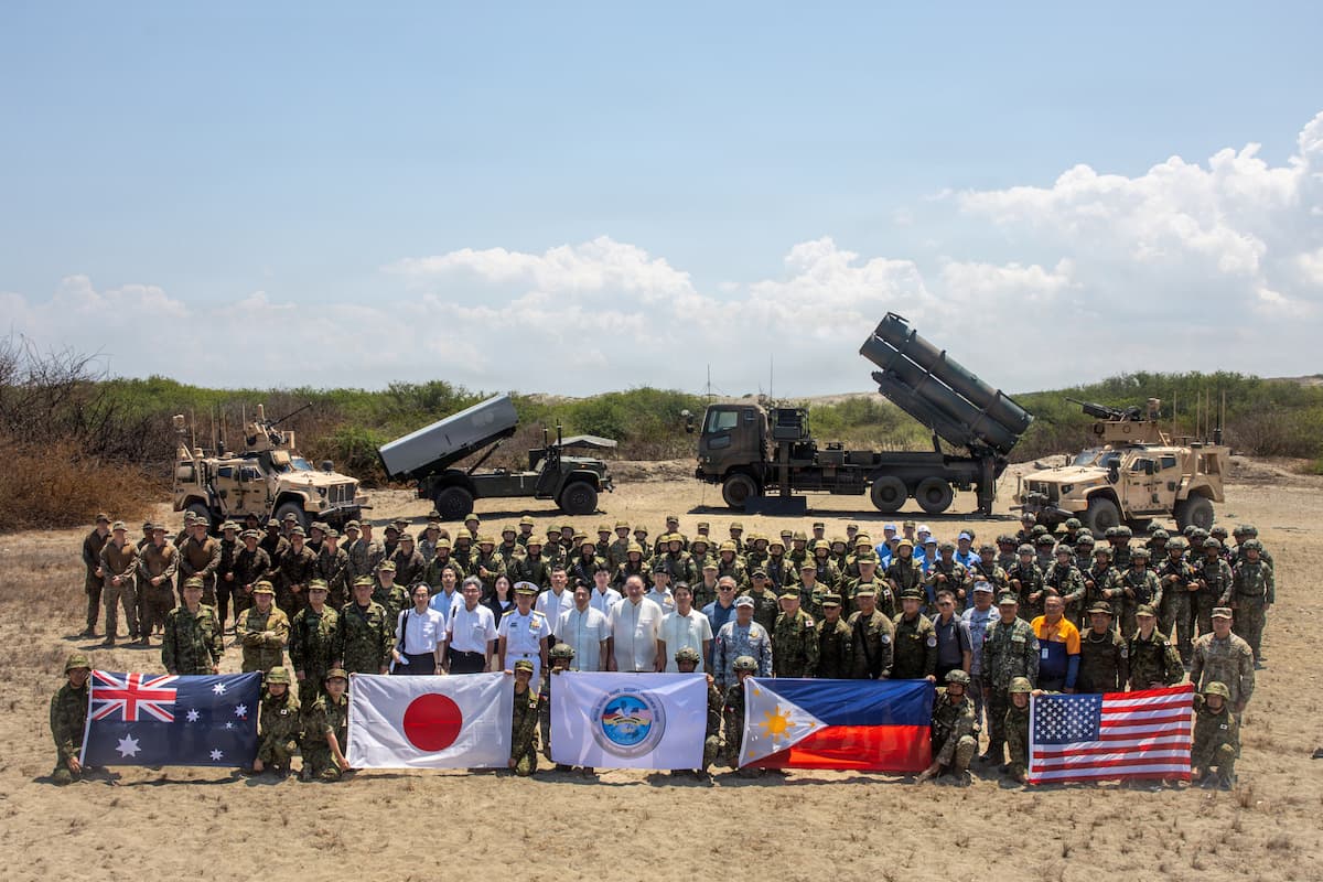 Philippine Defense Secretary Gilberto Teodoro Jr. and Japanese Defense Minister Shinjiro Koizumi with U.S., Philippine, Japanese and Australian troops at Paoay Sand Dunes after the maritime strike, May 6, 2026